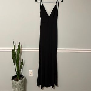 Long formal tight black dress. Very low back and scrunch on the butt. Size small